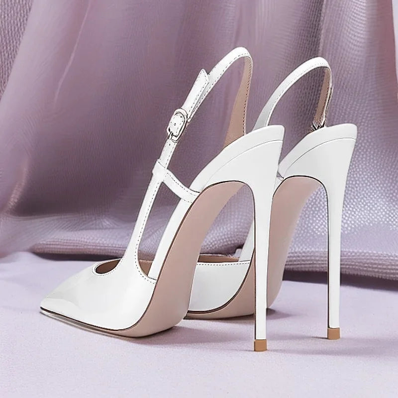 New silver patent leather flat buckle sandals with pointed edges and slim heels, stylish and stylish, worn in the backless style